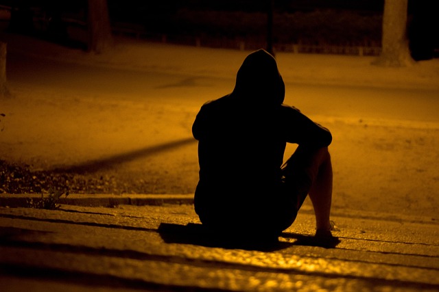 When your mind won’t stop, even the quietest nights feel the loudest. A young man sitting alone at night feeling anxious and lost in overthinking, showing the emotional impact of anxiety